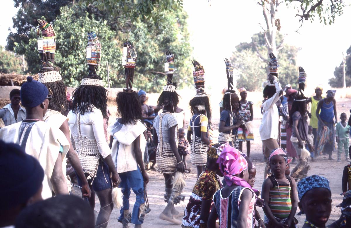 Young men in performance with animal crests on their heads