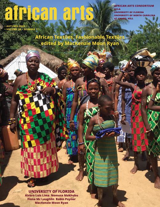 A photograph of a Ghanaian woman wearing in wrapped kente cloth, surrounded by younger women also wearing handwoven wrapped cloth