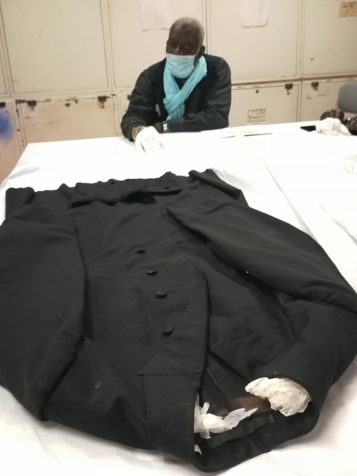 the artist in front of his object in this case an overcoat