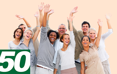 Group of people enthusiastically raising their hands to volunteer