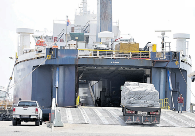 A truck drives into the MV Blue Wave Harmony at the Port-of-Spain Ferry Terminal on Monday. PHOTO BY FAITH AYOUNG