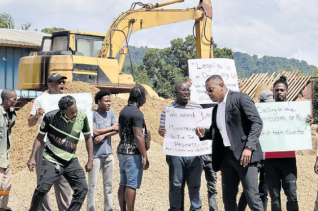President of the Trinidad and Tobago Aggregate Producers Alliance Nigel Tenia joins quarry workers during a protest at the Silica Sands Ltd Quarry, Silica Road, Valencia, yesterday. PHOTO BY ABRAHAM DIAZ