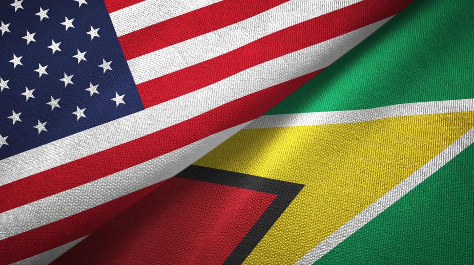 US and Guyana Flags - 123RF