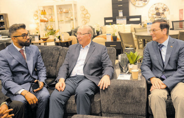 Minister of Land and Legal Affairs Saddam Hosein, left, speaks with Unicomer Group executive vice president, Guillermo Siman, and Ministry of Trade, Investment and Tourism parliamentary secretary, Dr Colin Neil Gosine, during the opening ceremony of the new Courts Megastore in Barataria yesterday.