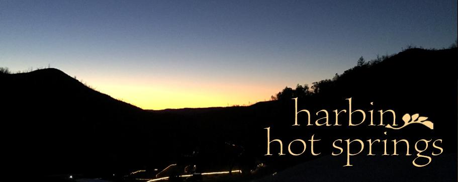 Yellow and pink sunrise over the dark hillsides surrounding Harbin canyon.