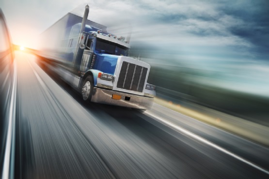 A truck drives on the highway