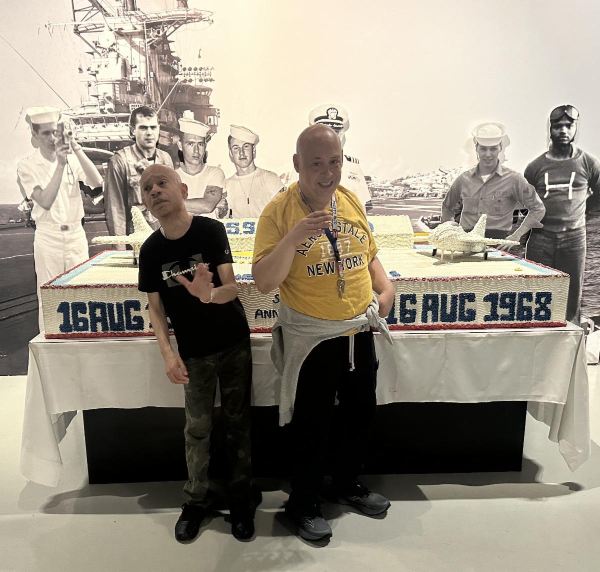 Cornell and Steven pose at the Intrepid in front of an exhibit. 