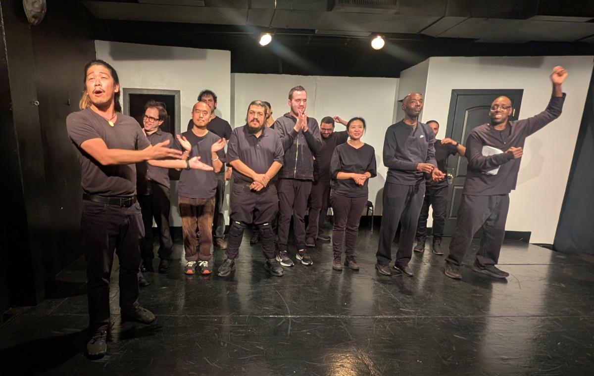 The entire crew smiles as they take their bows at the end of the show. 