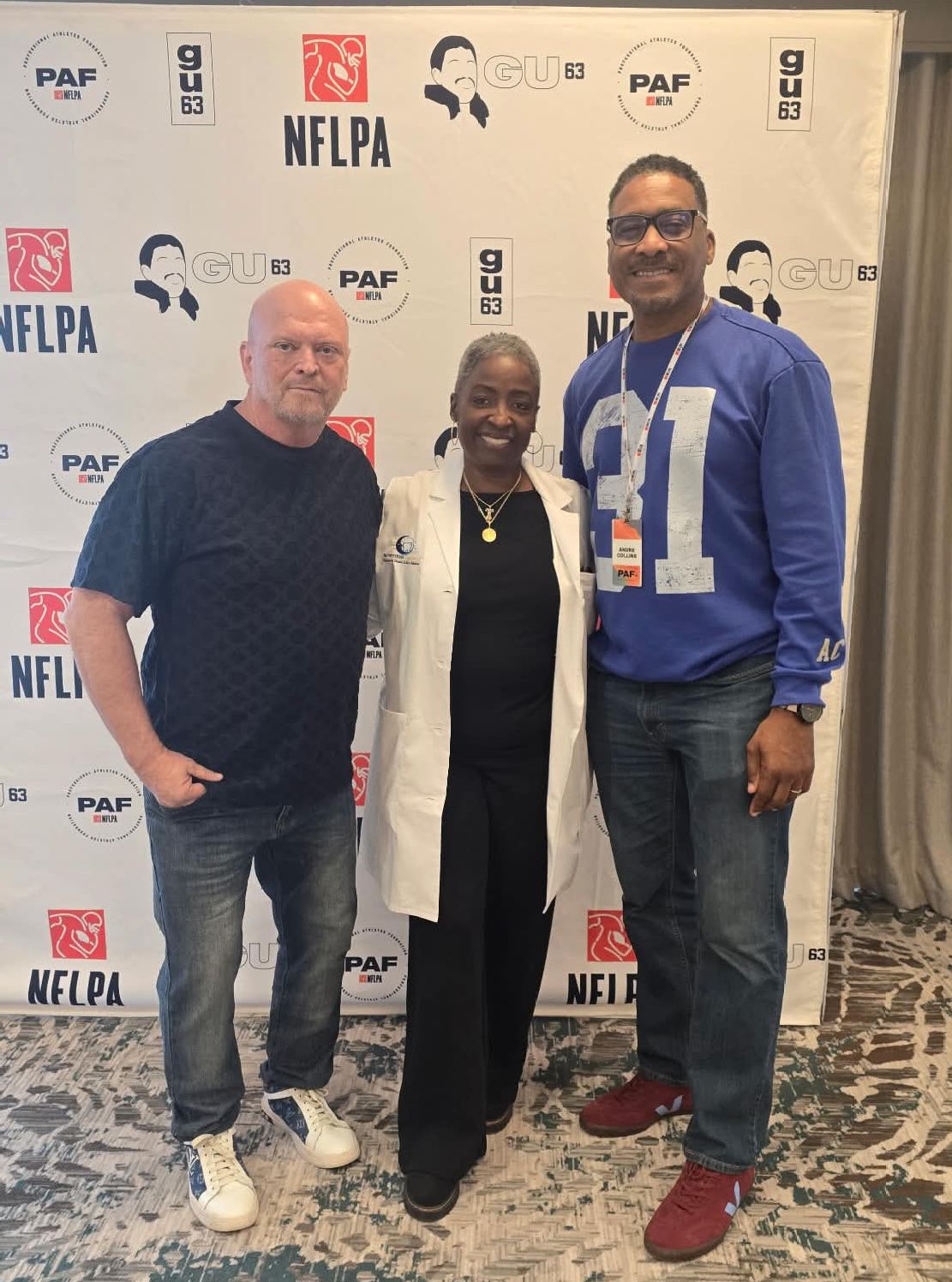 Dr. Venitress Carrington with NFLPA representatives at health screening event in Atlanta