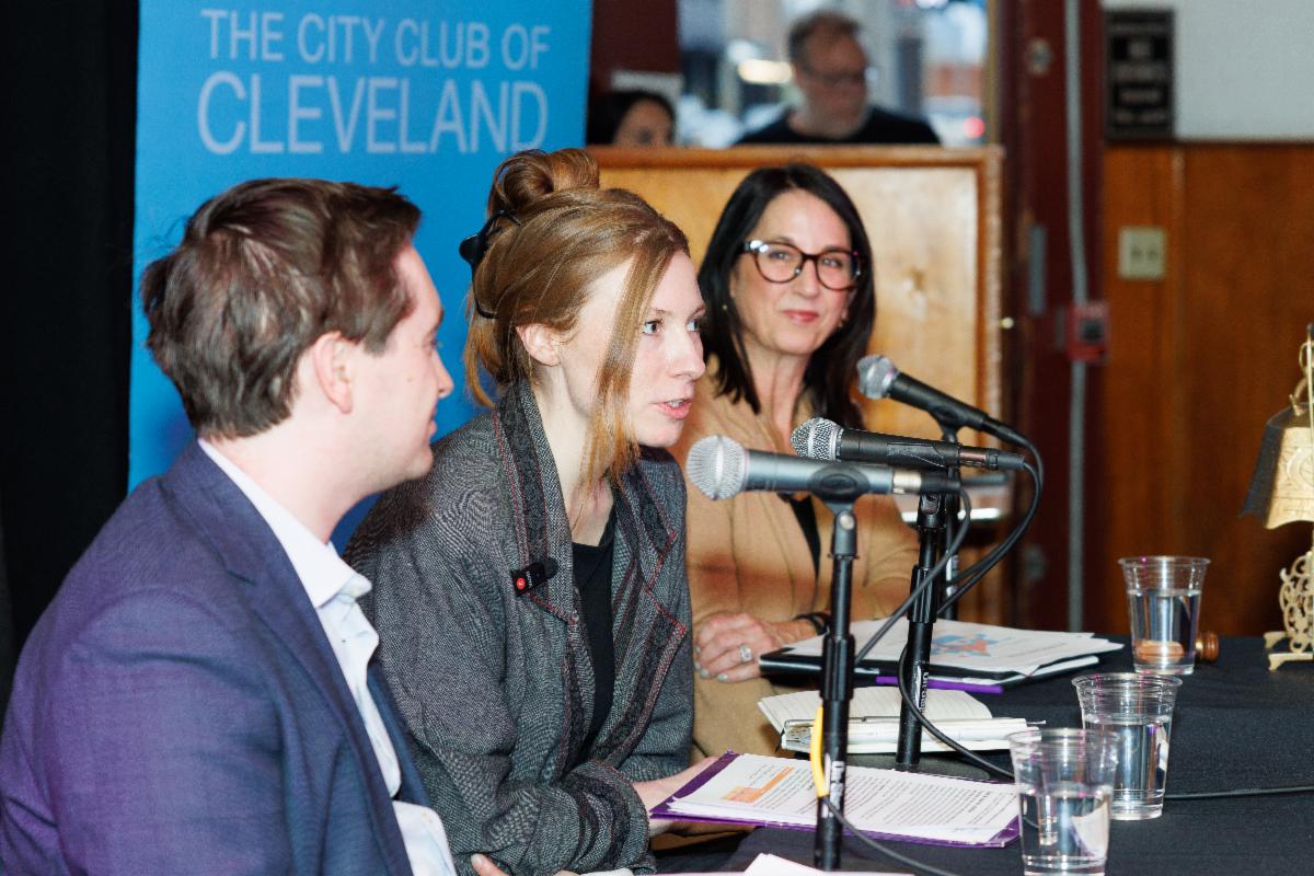 Mary Cierebiej moderating a City Club panel discussion at the Happy Dog
