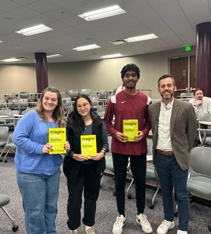 Audience members who won books, standing next to Paul Fleming