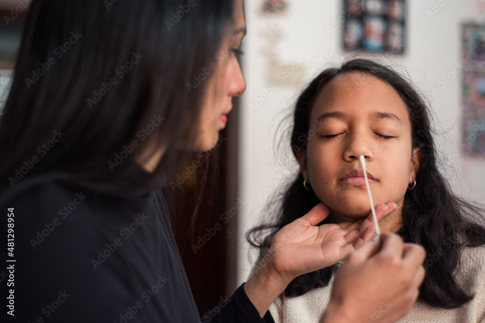Student taking nose swab