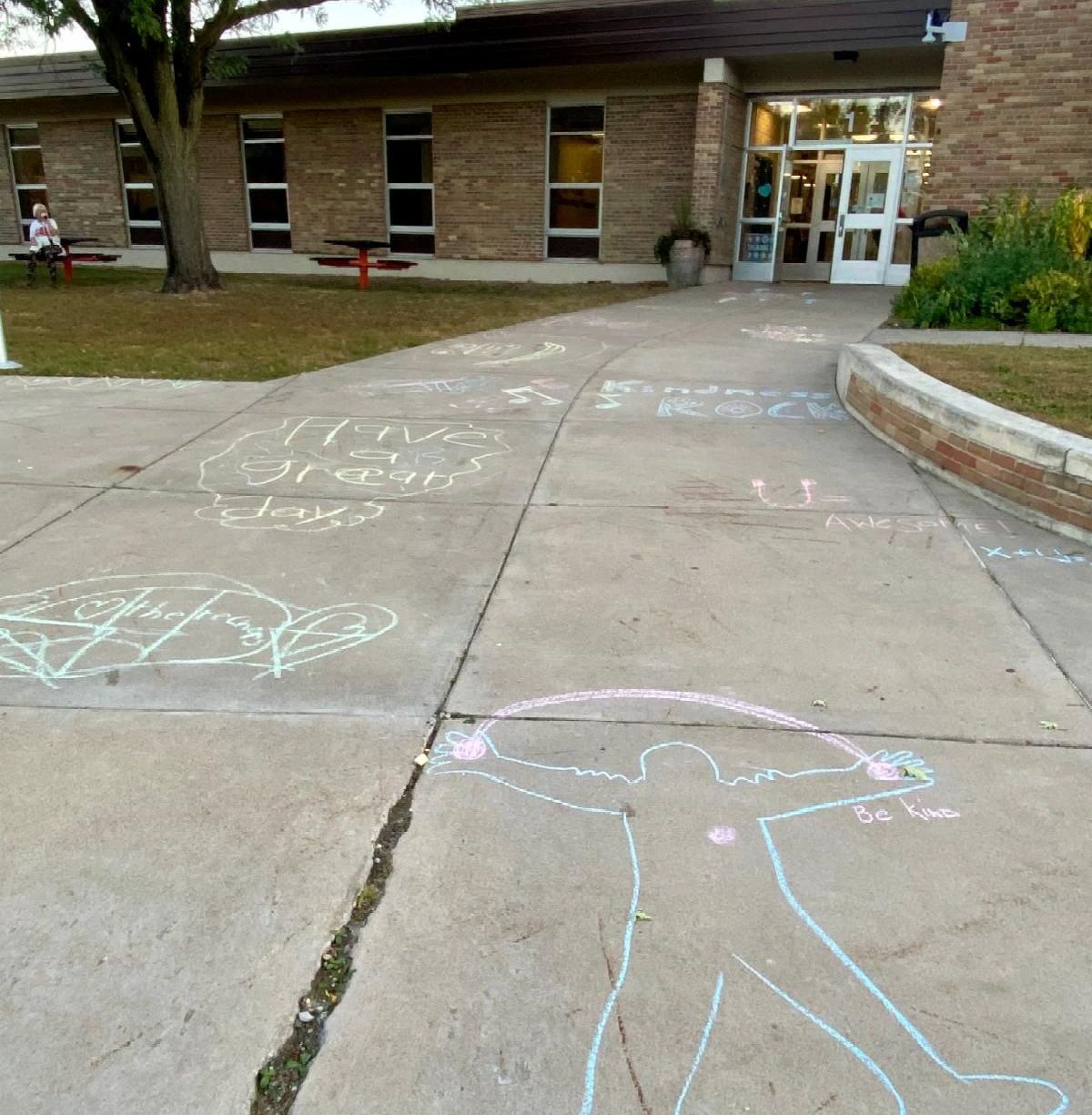 Sidewalk Chalk person with rainbow overhead