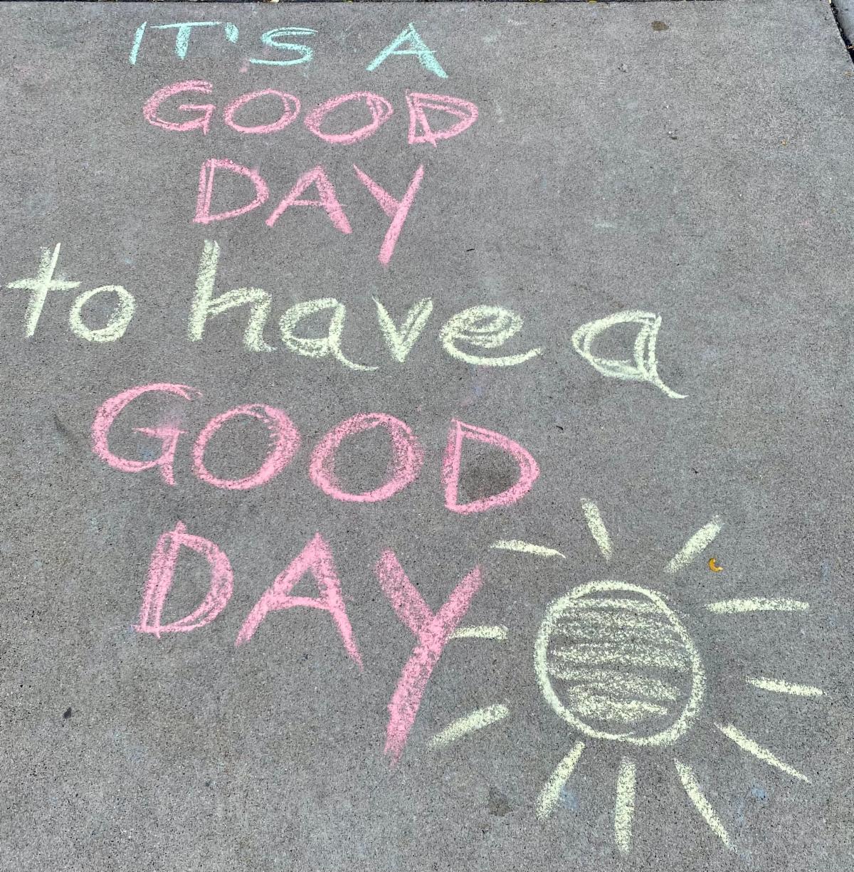 "It's a good day to have a good day" sidewalk chalk in front of Peter Hobart