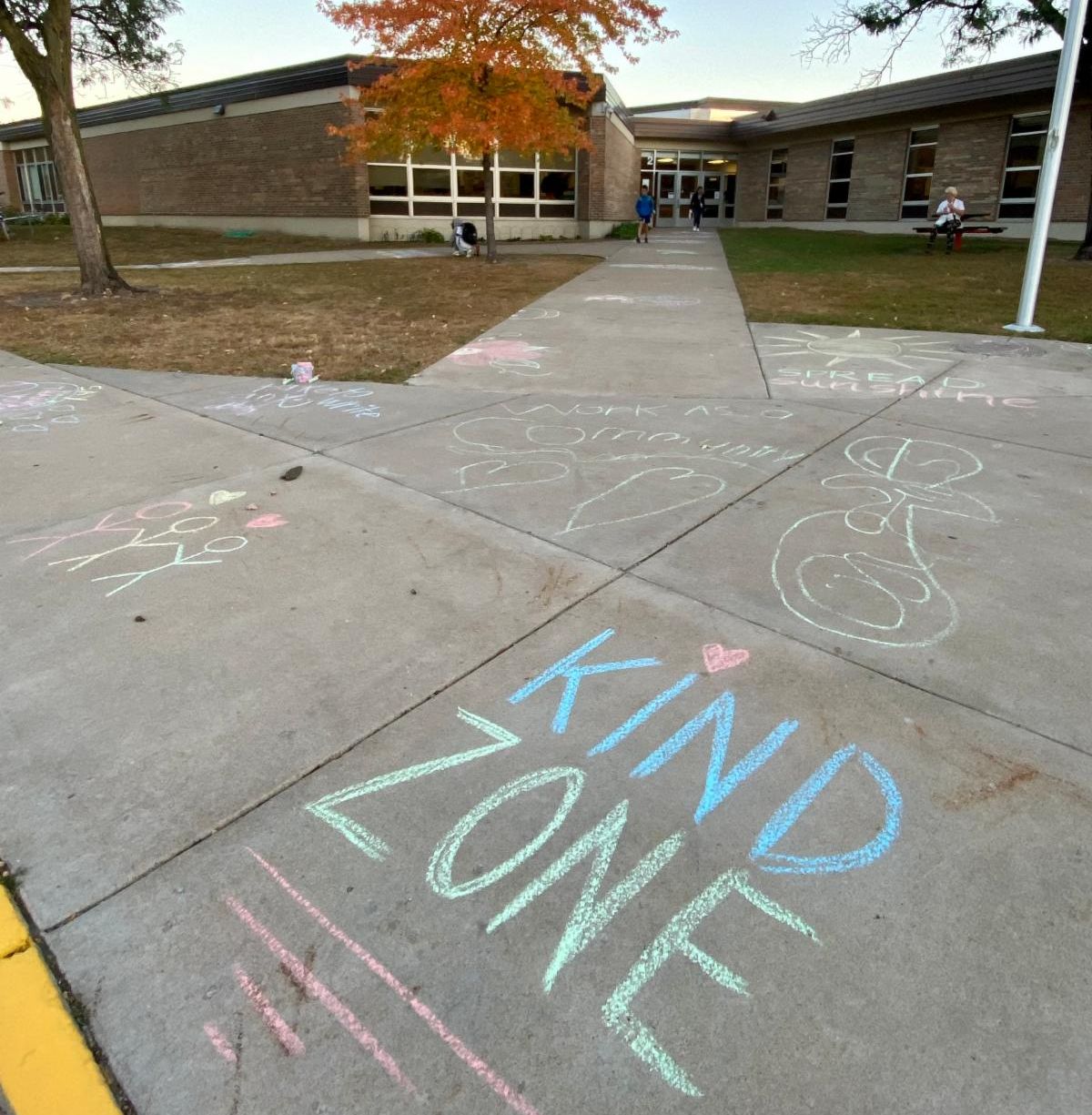 "Kind Zone" sidewalk chalk in front of Peter Hobart