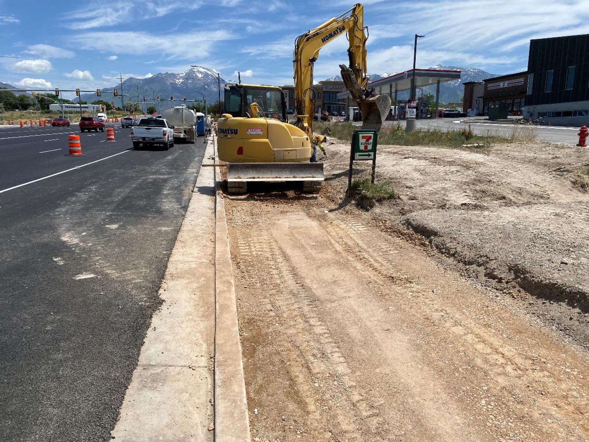 Finish work between 700 West and 900 West includes sidewalks and driveway connections.