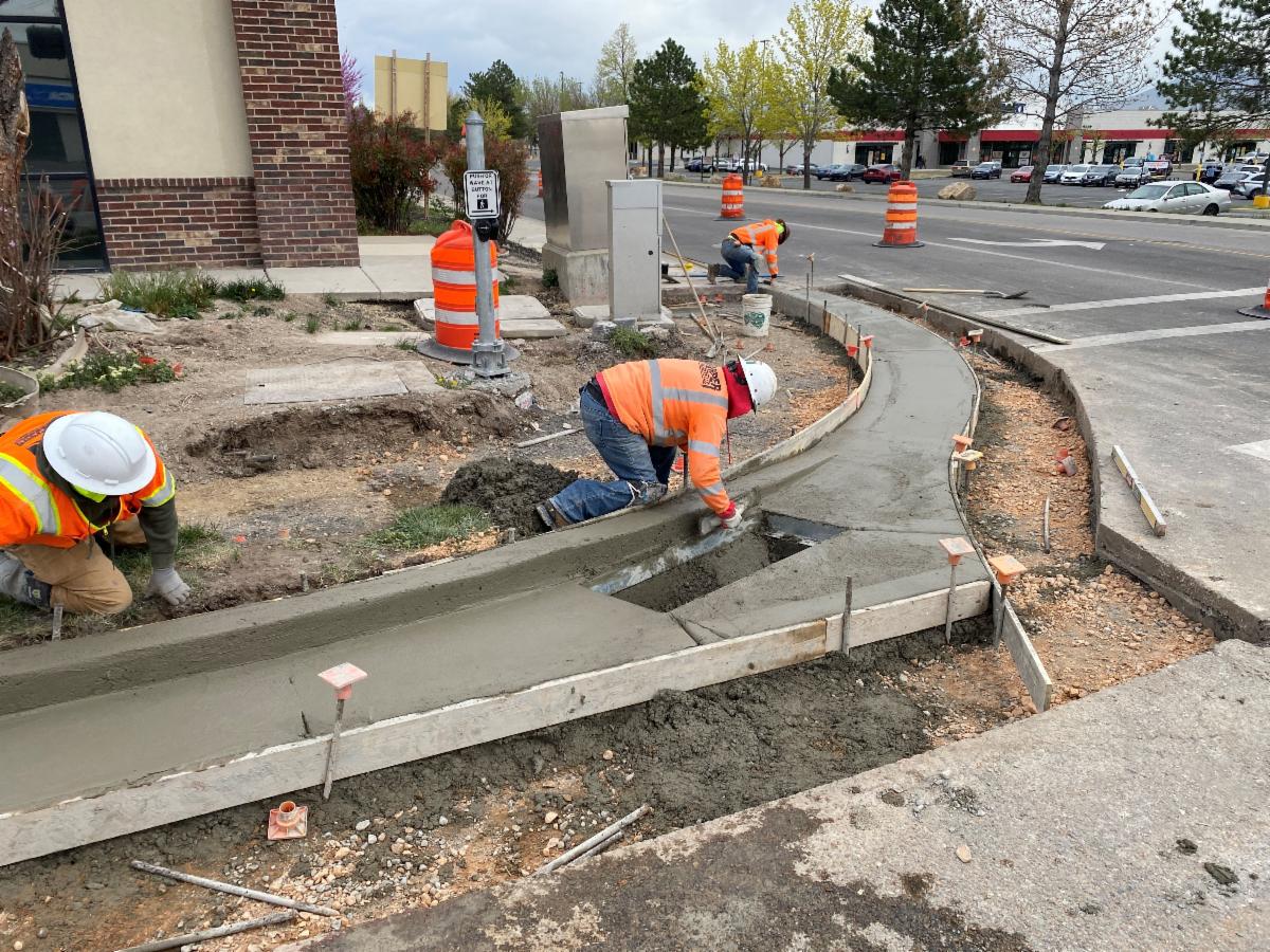 Crews installing new curb and gutter and ADA accessible pedestrian ramps on 9000 South. 