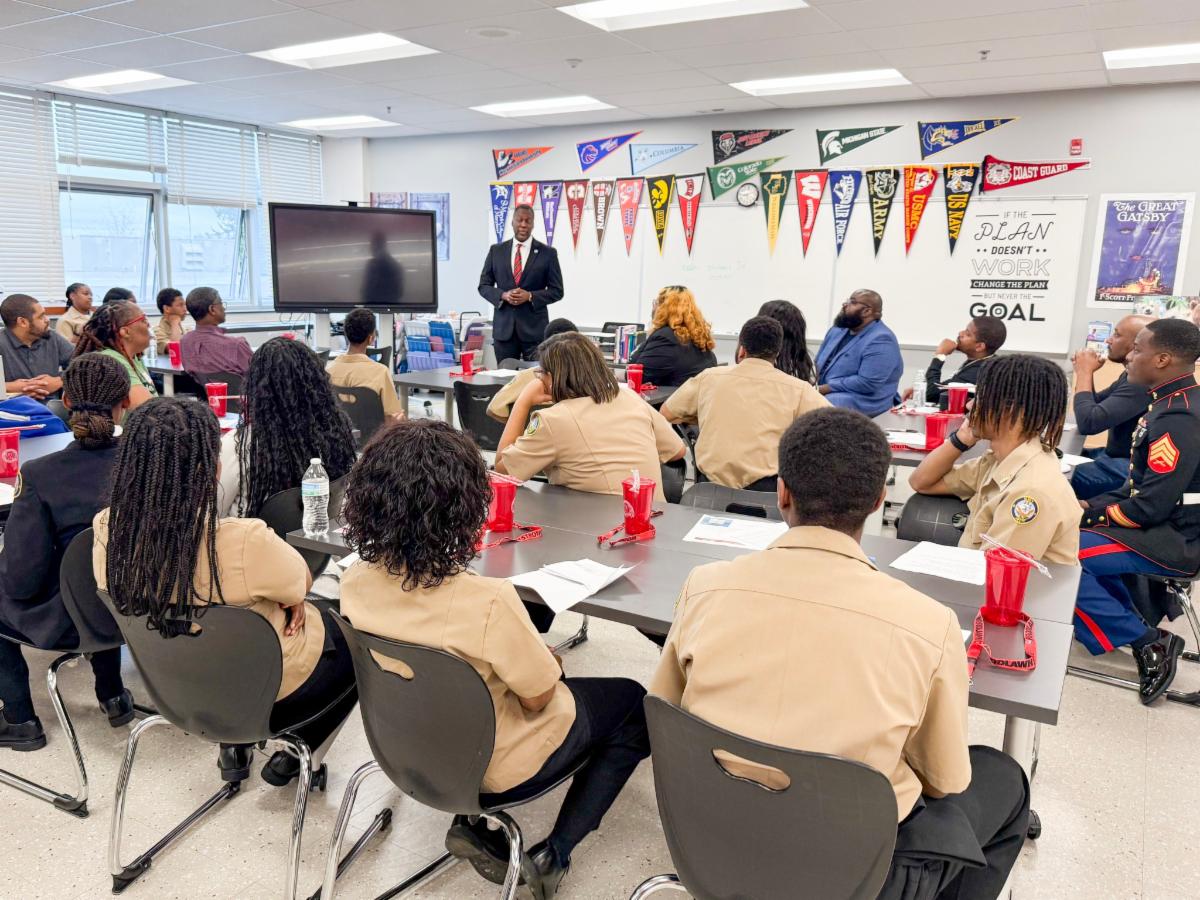 A photo of County Executive Calvin Ball speaking to students at Woodlawn High School's Alumni Career Day.