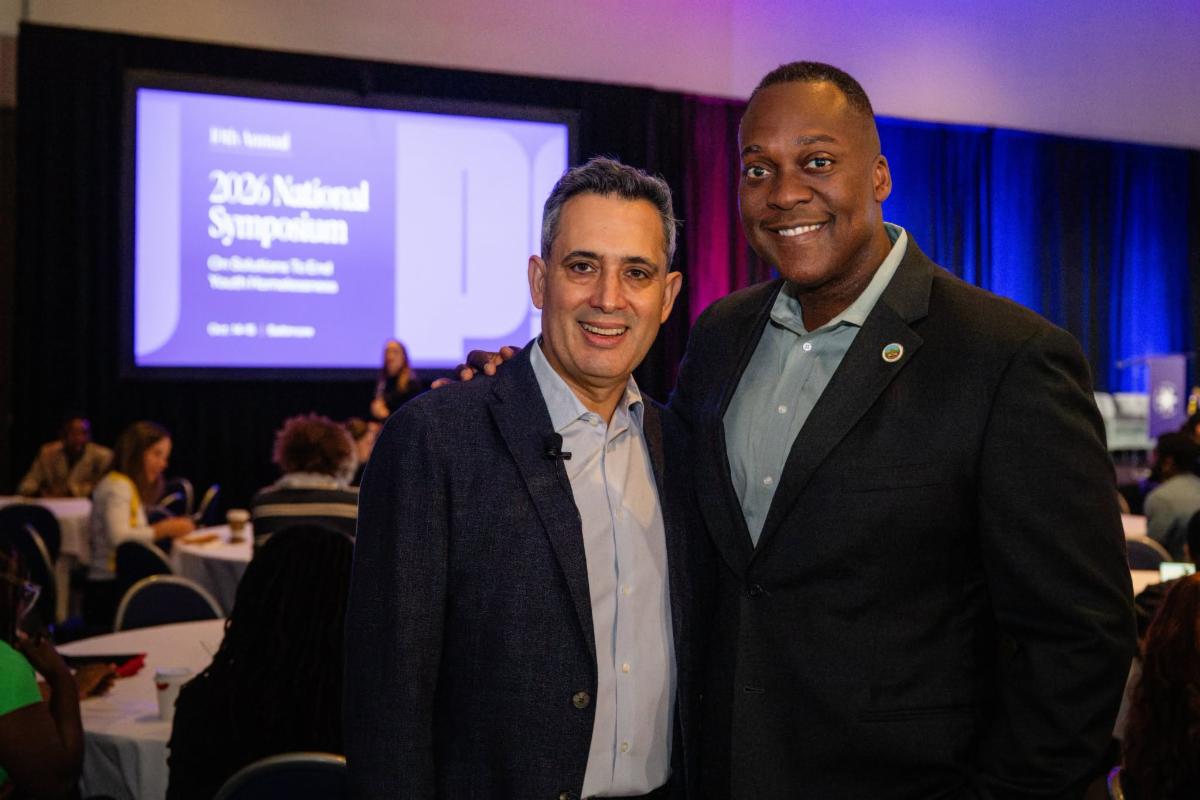 County Executive Calvin Ball posed with Point Source Youth Co-Founder and Executive Director Larry Cohen at the organization's 2026 National Symposium in Baltimore.