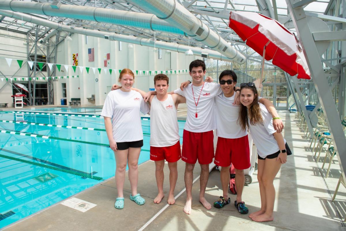 Group of five lifeguards posed for the camera at the County's Department of Recreation & Park Roger Carter Community Center in Ellicott City.