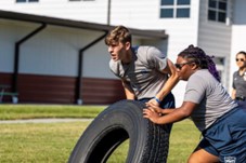A photo of two youth participating in Howard County Police Department's P.L.E.D.G.E. Summer Leadership Camp.