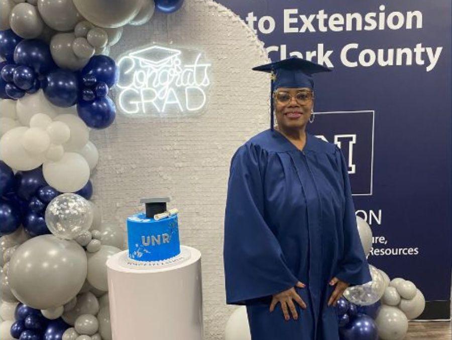Lisa Davis posing for a photo on her graduation. 