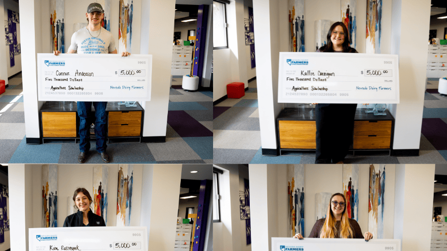 Four scholarship recipients posing with giant checks from the Nevada Dairy Farmers.