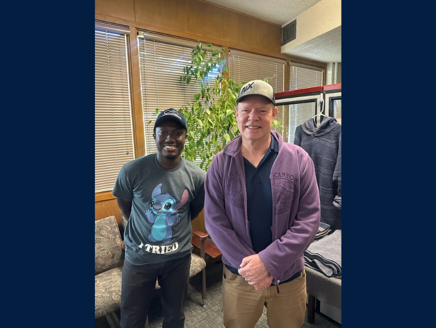 Two men standing side by side.