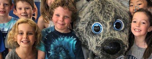 Children with University of Nevada Reno mascot.