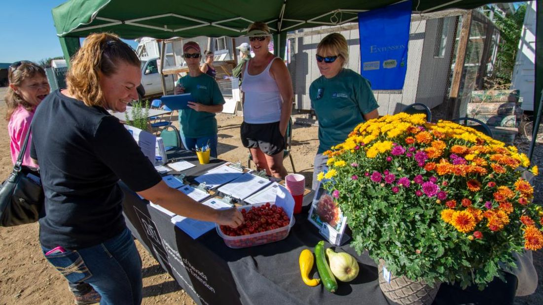Master gardeners hosting a booth at Field Day.