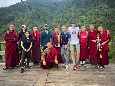 MIT students Pedro Matarranz, Mariana Reyes-Holguin and Jazmin Mucino with Bhutanese monks.