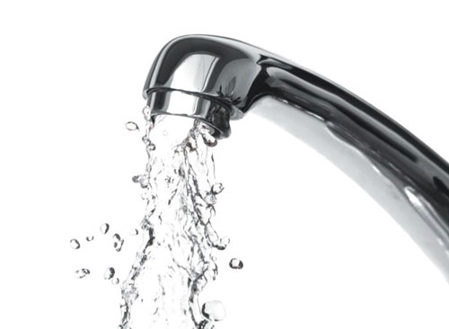 On-demand water system for an outdoor kitchen