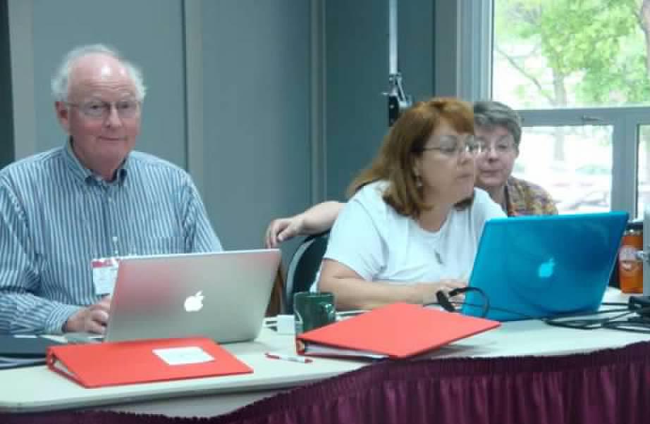 Image of people running AV equipment with laptops