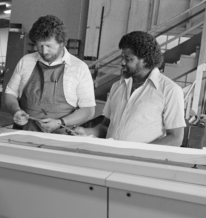 Two workers at inserter