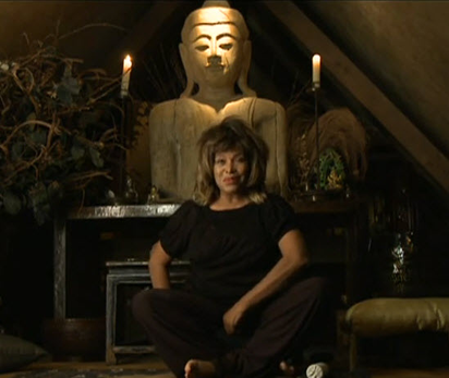 Tina sitting in front of altar