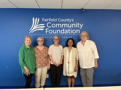 Reproductive Justice Committee in front of Fairfield County's Community Foundation sign