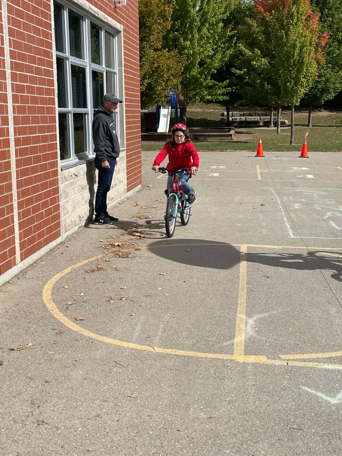 A student learns to ride a bike