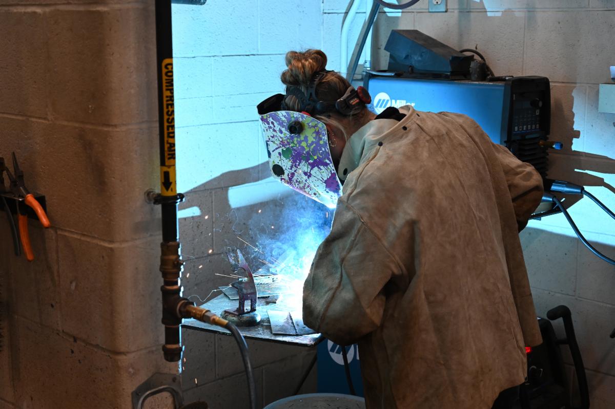 A student practicing welding at the TVDSB Skills Competition