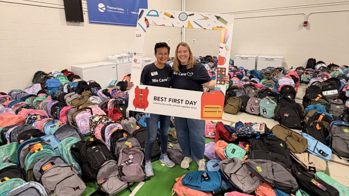TVEF staff surrounded by backpacks collected through the 2026 Best First Day drive