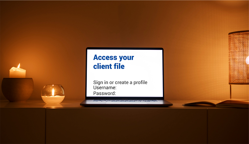 Client portal image of laptop with "Access Your Client File" headline
