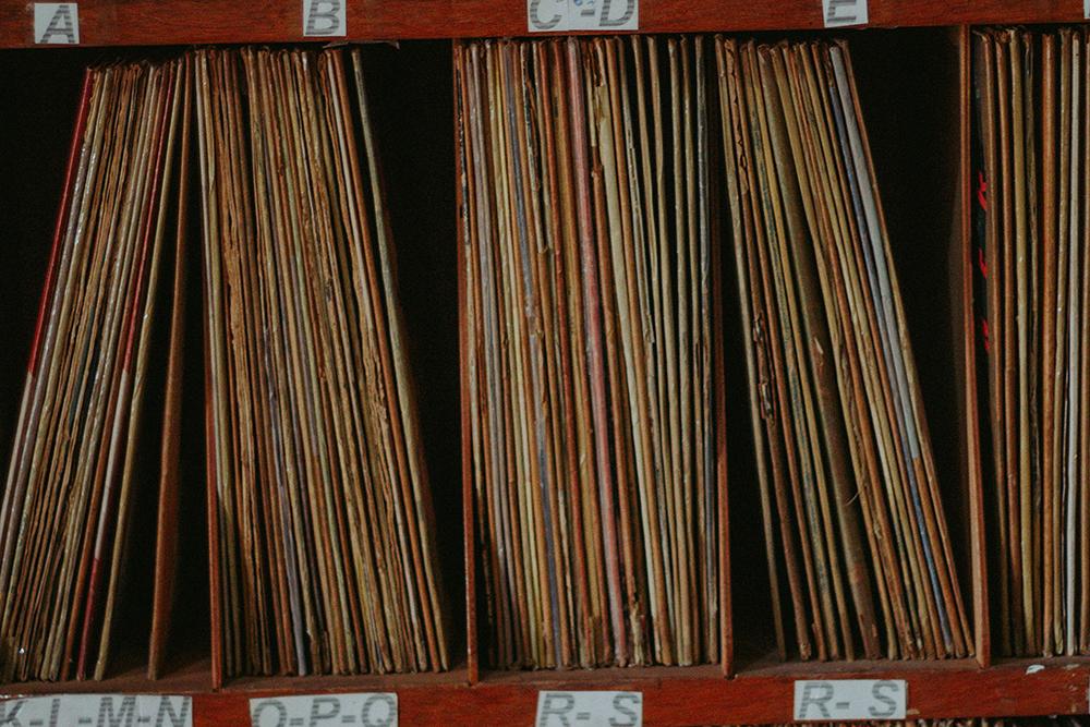 Paper files on shelves