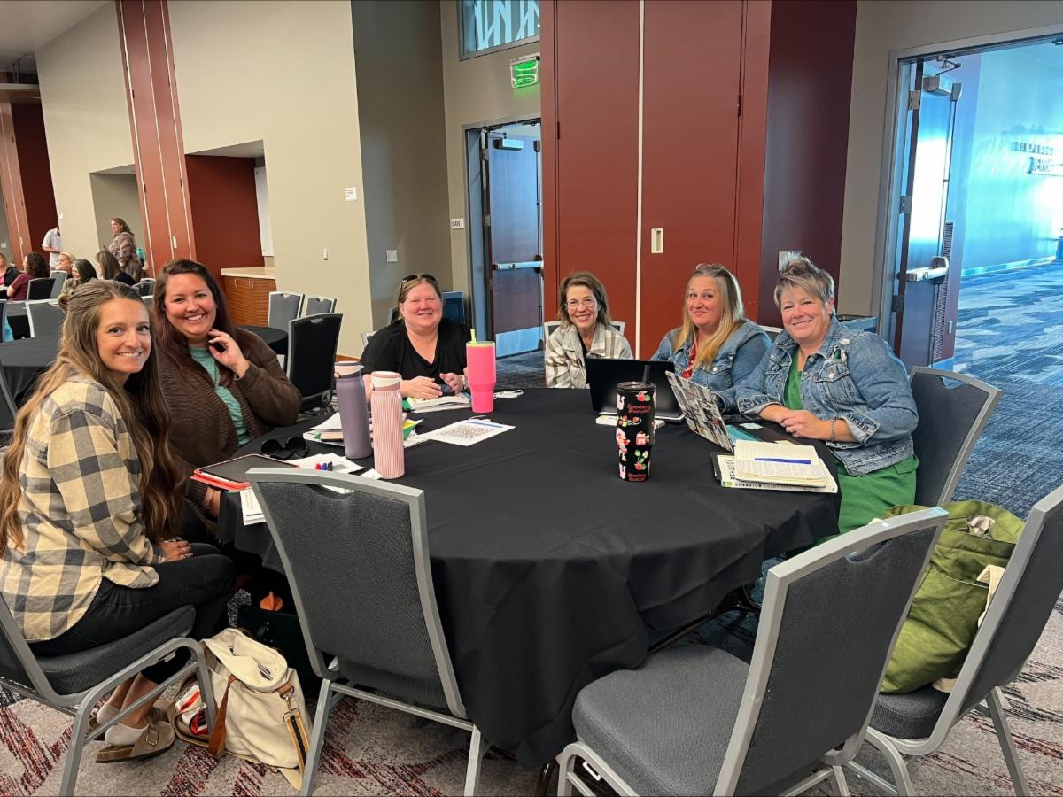 Photo 4 of participants at a table at the 2026 Behavior Support and Prevention Summit  