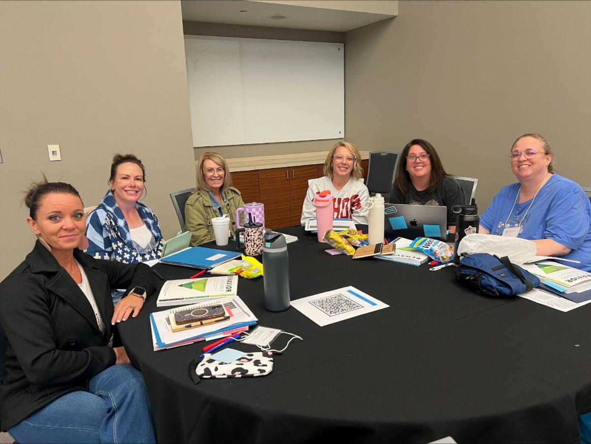 Photo 1 of participants at a table at the 2026 Behavior Support and Prevention Summit  