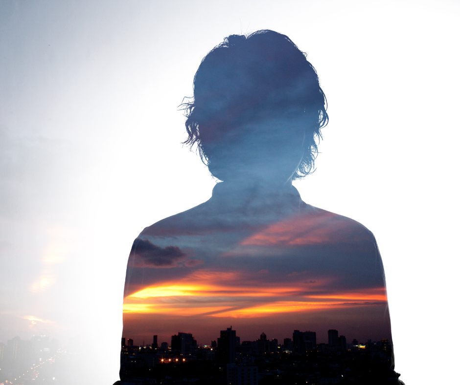 shadow of a person with sunrise inside person's silouette