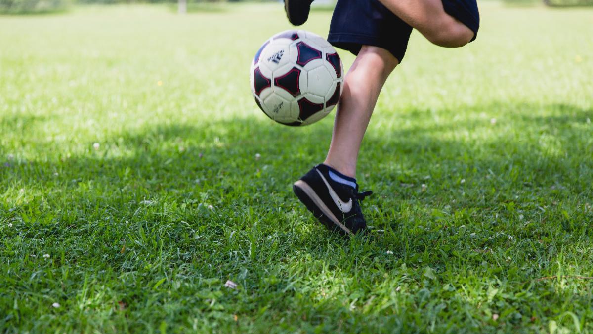 Child playing with soccer ball.