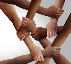 Business diversity and teamwork as a group of diverse people holding arms as a multiracial society and multicultural community joined and united team building as a together and togetherness concept.