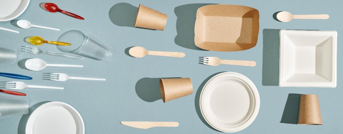 A group of food containers appears on a blank background. On the one side, there is a grouping of items that do not compost easily. On the other side, there is a grouping of items that compost.