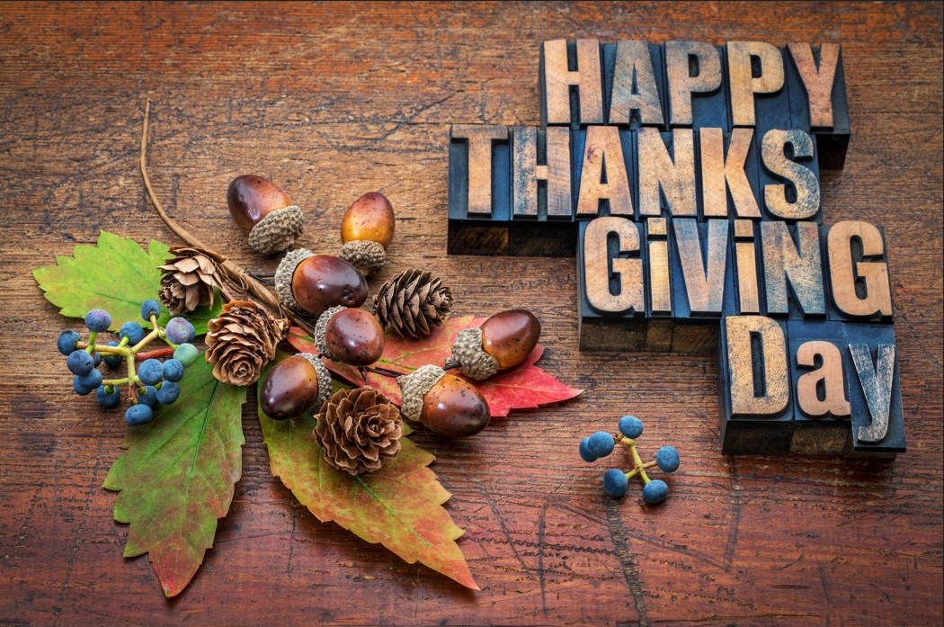 Happy thanksgiving in wood blocks on old wood planks