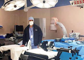 Dr. Herman Dhotar performs anterior hip replacement surgery on a specialized piece of equipment called a HANA table.