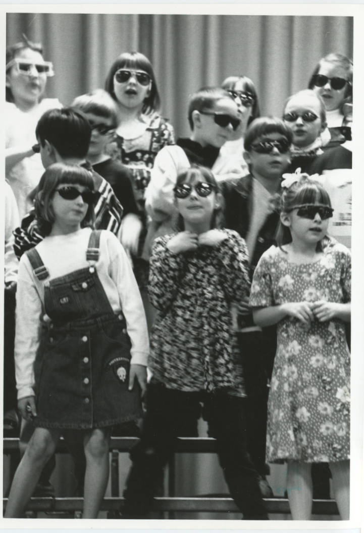 Black and white photo of kids wearing sunglasses